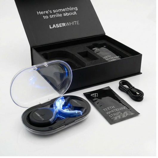 LaserWhite Kit box open with dual-light LED device and whitening strips